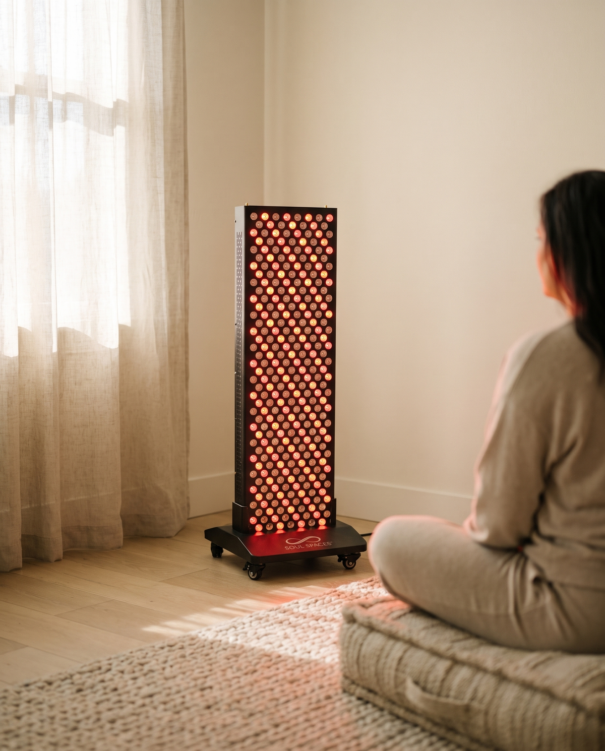 Solstice Red Light Panel glowing in a bedroom corner during a morning session